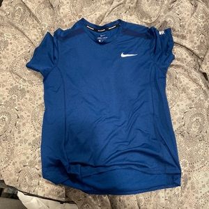 Blue Nike dri fit shirt for athletic wear.